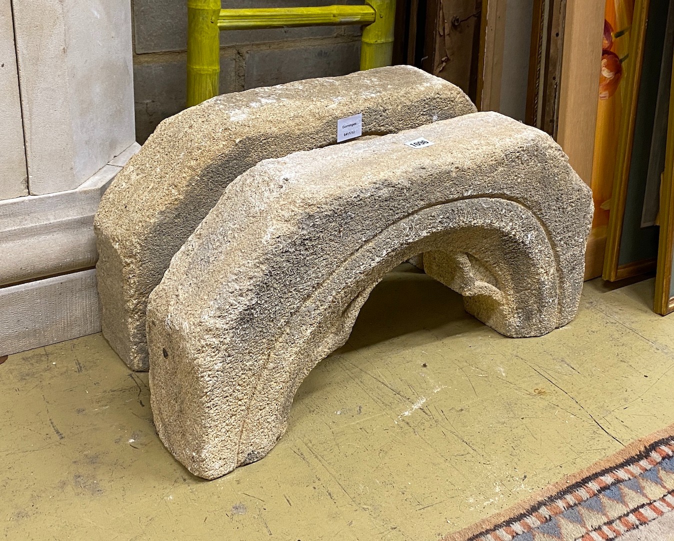 A pair of stone arches, width 64cm, height 31cm